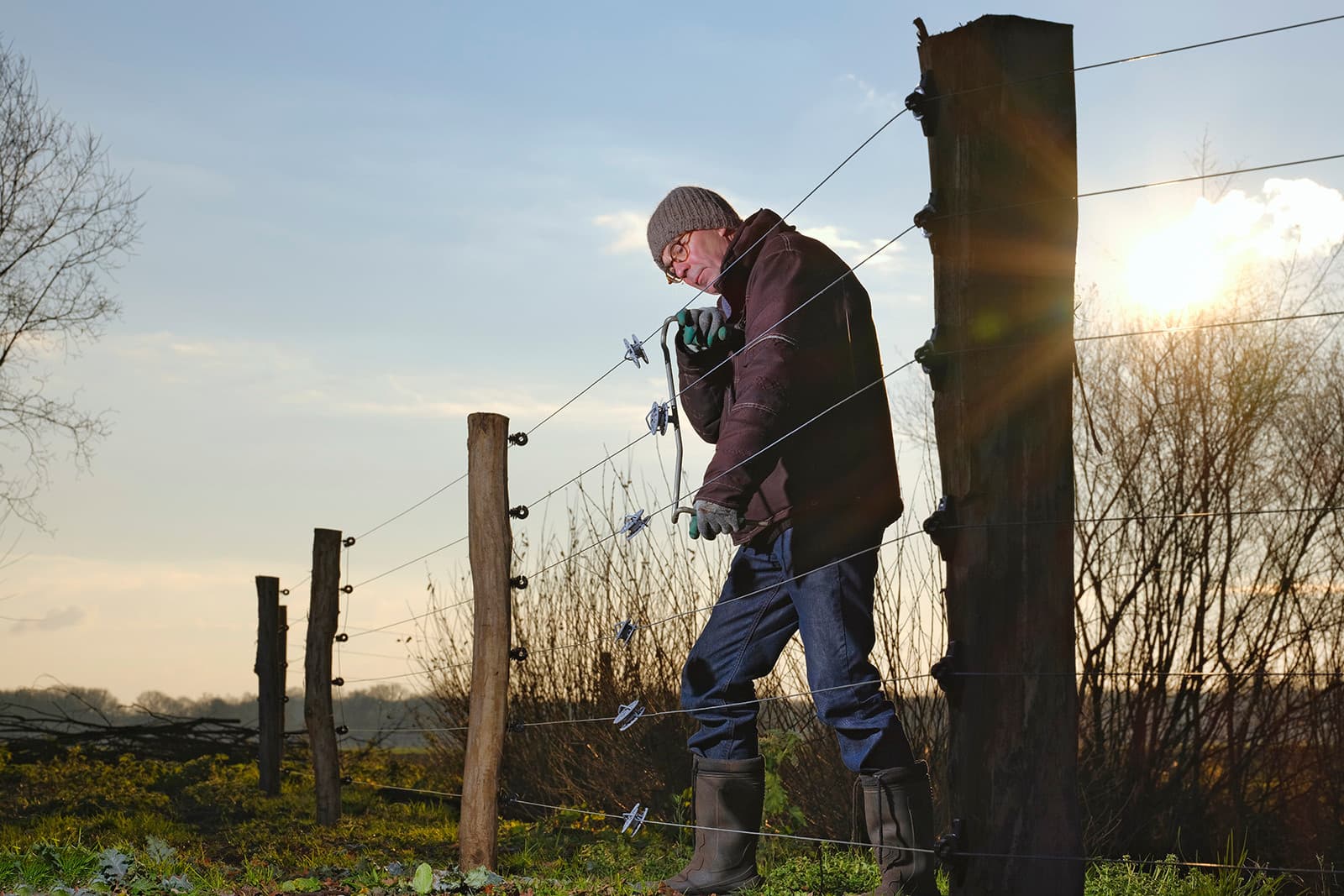 Plaatsen van wolfraster. – Foto: Ruud Ploeg