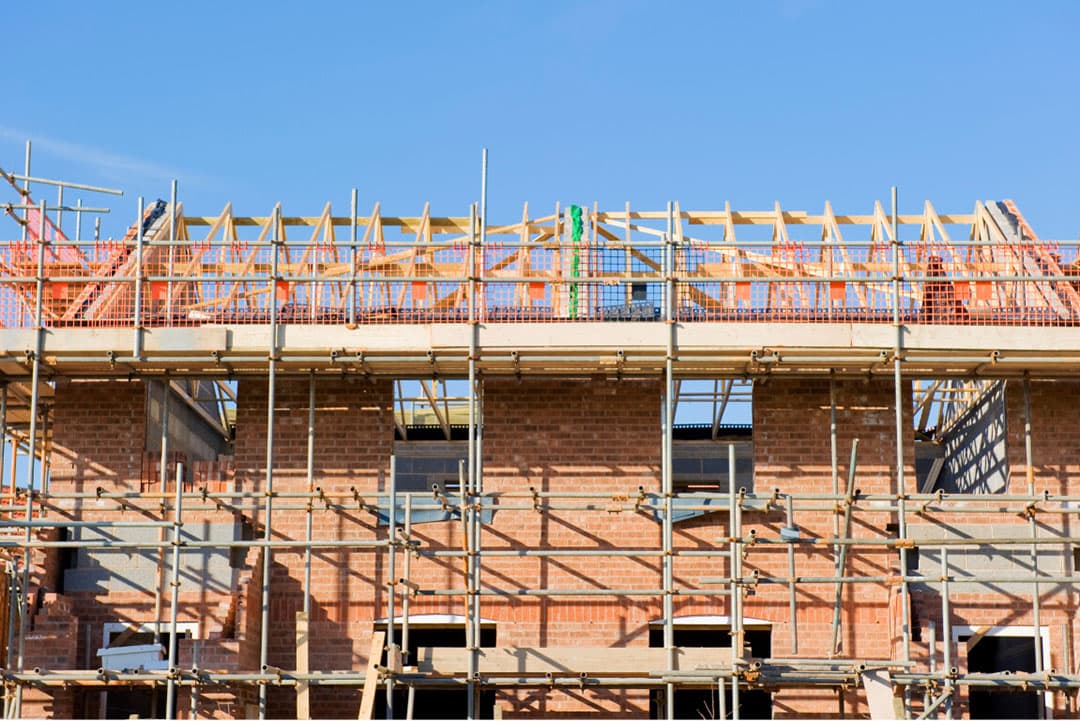 De schade als gevolg van het Programma Aanpak Stikstof (PAS), wordt het meest gevoeld in de bouwsector. Foto: Canva