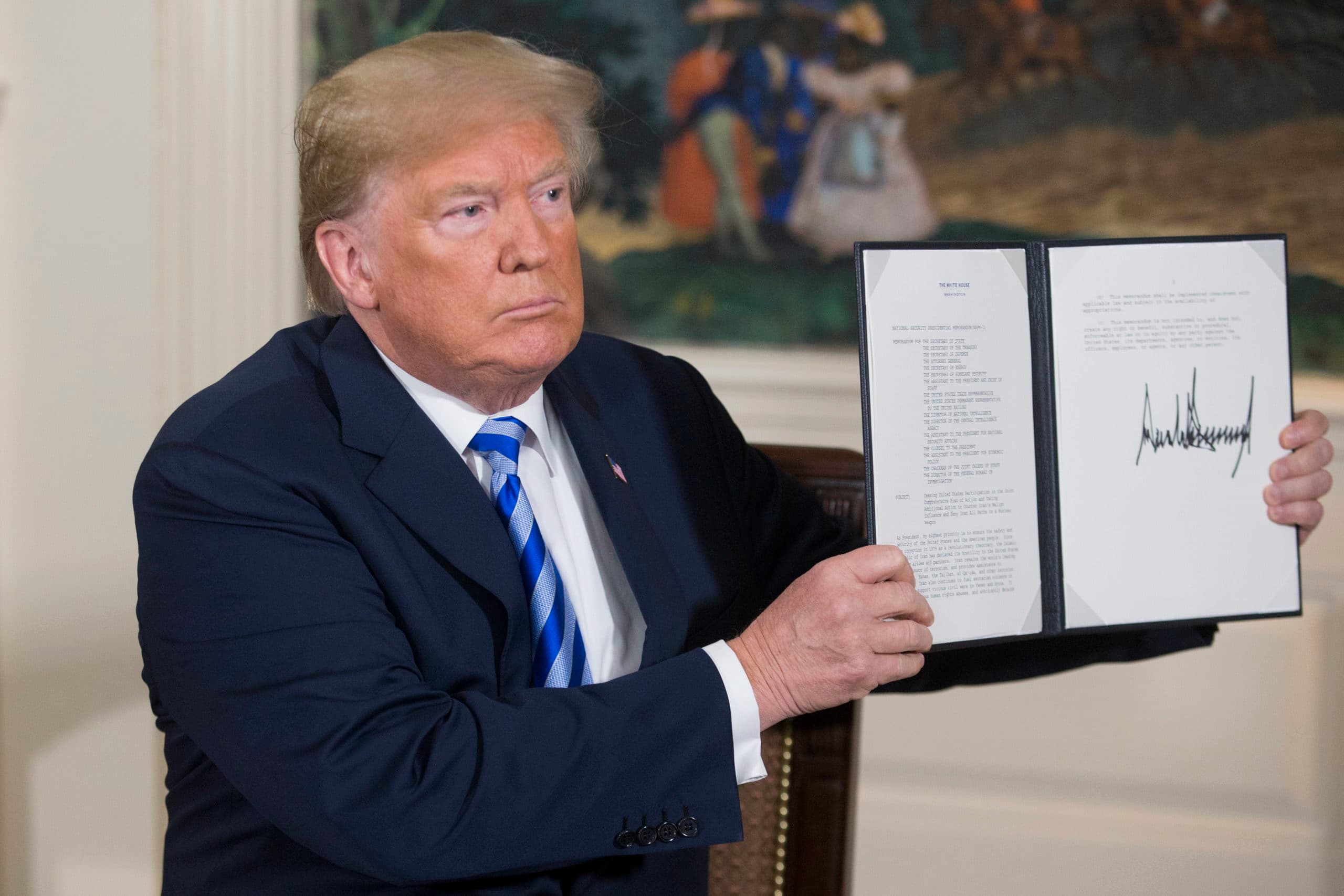 epa06720144 US President Donald J. Trump holds up a national security presidential memorandum on Iran that he just signed in the Diplomatic Reception Room of the White House in Washington, DC, USA, 08 May 2018. Trump announced plans to pull out of Iran nuclear deal. Trump announced that he will reimpose sanctions that had been waived under the Iran nuclear deal. Five nations including the United States worked out a deal with Iran in 2015 that withdrew sanctions.  EPA/MICHAEL REYNOLDS